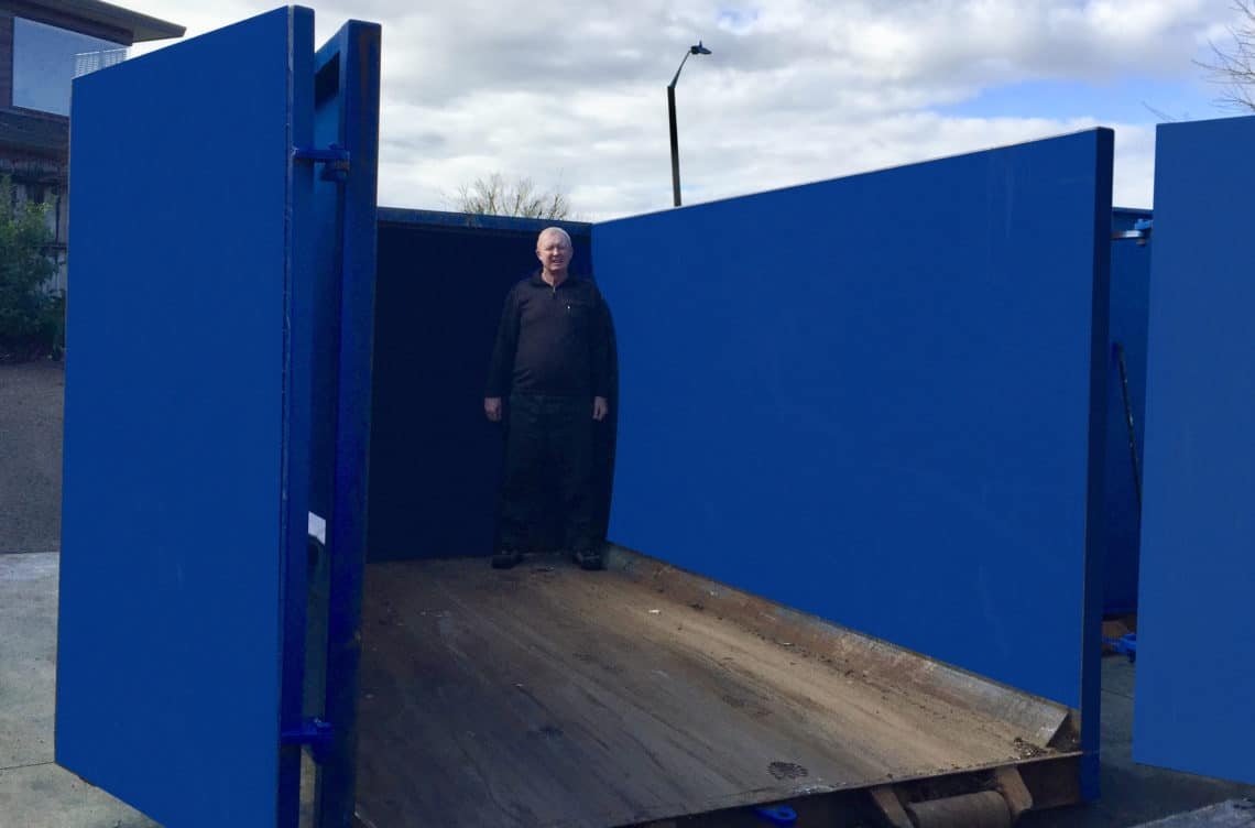 Man inside a 15 metre rubbish bin